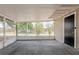 Cozy screened porch with ample space for relaxation and outdoor enjoyment at 4906 S 87Th St, Tampa, FL 33619