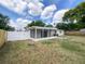 View of screened in porch and large fenced-in backyard at 1207 Lorie Cir, Brandon, FL 33510