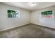 Neutral bedroom with carpet, two windows and plenty of space at 1207 Lorie Cir, Brandon, FL 33510