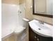 Well-lit bathroom with a single vanity and shower with white tiled walls at 1819 E Humphrey St, Tampa, FL 33604