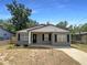 Charming single-story home with a well-maintained lawn and inviting entrance, perfect for a cozy lifestyle at 1819 E Humphrey St, Tampa, FL 33604