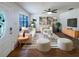 Bright and airy living room featuring modern decor, stylish furnishings, sleek ceiling fan and ample natural light at 1819 E Humphrey St, Tampa, FL 33604
