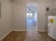 Functional utility room featuring tile flooring, a water heater, and easy access, perfect for storage and laundry at 1819 E Humphrey St, Tampa, FL 33604