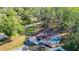 Aerial view of house, pool, driveway, and surrounding trees at 21940 Dupree Dr, Land O Lakes, FL 34639