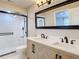 Bright bathroom with dual vanity, undermount sinks, and walk-in shower at 21940 Dupree Dr, Land O Lakes, FL 34639