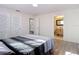 Bedroom with wood-look floors and ensuite bathrooms, each with a sink and vanity at 21940 Dupree Dr, Land O Lakes, FL 34639