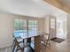 Dining area view with tile flooring and a large window view of the backyard pool at 21940 Dupree Dr, Land O Lakes, FL 34639