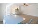 Open-concept dining area flows into a bright kitchen with white cabinetry and seating at 21940 Dupree Dr, Land O Lakes, FL 34639