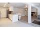 Kitchen featuring white cabinets, stainless steel appliances, breakfast bar and an open floor plan at 21940 Dupree Dr, Land O Lakes, FL 34639