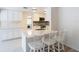 Updated kitchen with white cabinets, stainless steel sink, and a convenient breakfast bar at 21940 Dupree Dr, Land O Lakes, FL 34639