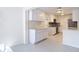 Modern kitchen with white cabinets, stainless steel appliances, and tile backsplash at 21940 Dupree Dr, Land O Lakes, FL 34639