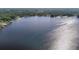 Expansive aerial view of the lake, perfect for boating, fishing, or relaxing by the water at 21940 Dupree Dr, Land O Lakes, FL 34639