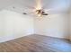 Spacious room with wood flooring and a ceiling fan at 21940 Dupree Dr, Land O Lakes, FL 34639