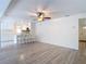 Spacious living room featuring modern floors, ample natural light, and a breakfast bar at 21940 Dupree Dr, Land O Lakes, FL 34639