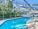 Relaxing in-ground pool with screened enclosure at 21940 Dupree Dr, Land O Lakes, FL 34639