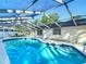 Sparkling in-ground screened pool at 21940 Dupree Dr, Land O Lakes, FL 34639