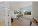 Bright home office with hardwood floors, natural light and a modern desk at 3772 Bath Ln, North Port, FL 34288