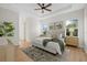 Serene main bedroom with tray ceiling, large windows, and a relaxing atmosphere at 3772 Bath Ln, North Port, FL 34288