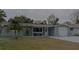 Charming single-story home with a well-maintained lawn and a cozy front porch at 3841 Chaffey Dr, New Port Richey, FL 34652