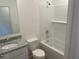Clean bathroom featuring granite countertops, a bathtub, and modern fixtures at 11330 Godwit Ave, Weeki Wachee, FL 34613