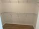 Spacious walk-in closet with shelving at 11330 Godwit Ave, Weeki Wachee, FL 34613
