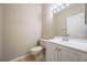Bathroom featuring tile floors, toilet, sink, and vanity with storage space at 1171 Clays Trl, Oldsmar, FL 34677