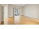 Bright bedroom with wood floors and sliding glass door leading to an outdoor patio at 1171 Clays Trl, Oldsmar, FL 34677