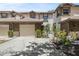 Charming townhouse with a well-maintained front yard, featuring a brick facade and an attached garage for convenient parking at 1171 Clays Trl, Oldsmar, FL 34677