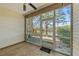 Screened lanai with ceiling fan and a view of the lake at 1171 Clays Trl, Oldsmar, FL 34677