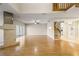Spacious living room featuring hardwood floors, a fireplace, and sliding glass doors, offering a comfortable living space at 1171 Clays Trl, Oldsmar, FL 34677