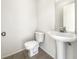 Powder room featuring a toilet and pedestal sink at 3403 30Th E Ln, Bradenton, FL 34208