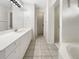 Bright bathroom with double vanity, recessed lighting, and tile flooring throughout at 3403 30Th E Ln, Bradenton, FL 34208