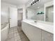 Bright bathroom with a soaking tub, spacious vanity, and large mirror at 3403 30Th E Ln, Bradenton, FL 34208