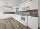 Well-lit kitchen with sleek white cabinets, modern appliances, and durable countertops at 3403 30Th E Ln, Bradenton, FL 34208