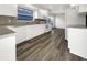 Well-lit kitchen featuring white cabinets, stainless steel appliances, and modern countertops at 3403 30Th E Ln, Bradenton, FL 34208