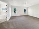 Spacious main bedroom with neutral carpet, ample natural light, and access to the attached bathroom at 3403 30Th E Ln, Bradenton, FL 34208