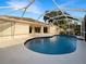 Outdoor pool with surrounding screened enclosure offers serene relaxation and entertainment at 3403 30Th E Ln, Bradenton, FL 34208