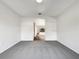 Open space featuring neutral walls, plush carpet, and an archway at 3403 30Th E Ln, Bradenton, FL 34208