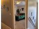 View of a sports-themed bedroom with carpet flooring, seen through an open doorway at 3721 Heron Island Dr, New Port Richey, FL 34655