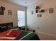 Sporty bedroom with football decor, window blinds, carpet, and themed accessories at 3721 Heron Island Dr, New Port Richey, FL 34655