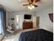 Bedroom featuring neutral walls, ceiling fan, and access to the bathroom at 3721 Heron Island Dr, New Port Richey, FL 34655
