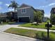 Charming two-story home featuring a well-maintained lawn, beautiful landscaping, and a two-car garage at 3721 Heron Island Dr, New Port Richey, FL 34655