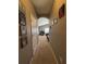 Hallway leading to a large room, Gathering photos hanging on the wall at 3721 Heron Island Dr, New Port Richey, FL 34655