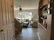 Bright and airy living room with comfortable seating, a ceiling fan, and staircase at 3721 Heron Island Dr, New Port Richey, FL 34655