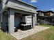 Enjoy the covered patio with a ceiling fan, grill, and a beautiful paver patio, perfect for outdoor gatherings at 3721 Heron Island Dr, New Port Richey, FL 34655
