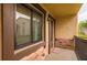 Cozy, covered condo balcony with brick detail offers an inviting outdoor space at 721 83Rd N Ave # 108, St Petersburg, FL 33702
