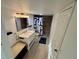Clean bathroom with tiled shower, stylish vanity, modern fixtures, and sleek design elements at 721 83Rd N Ave # 108, St Petersburg, FL 33702