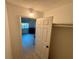 Bright bedroom features tile floors and natural light from the windows and an open closet at 721 83Rd N Ave # 108, St Petersburg, FL 33702