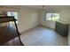 This light and airy bedroom has tile floors and two windows, creating a comfortable space at 721 83Rd N Ave # 108, St Petersburg, FL 33702