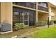 Condo with screened in porch and manicured landscaping showcasing comfortable outdoor living at 721 83Rd N Ave # 108, St Petersburg, FL 33702